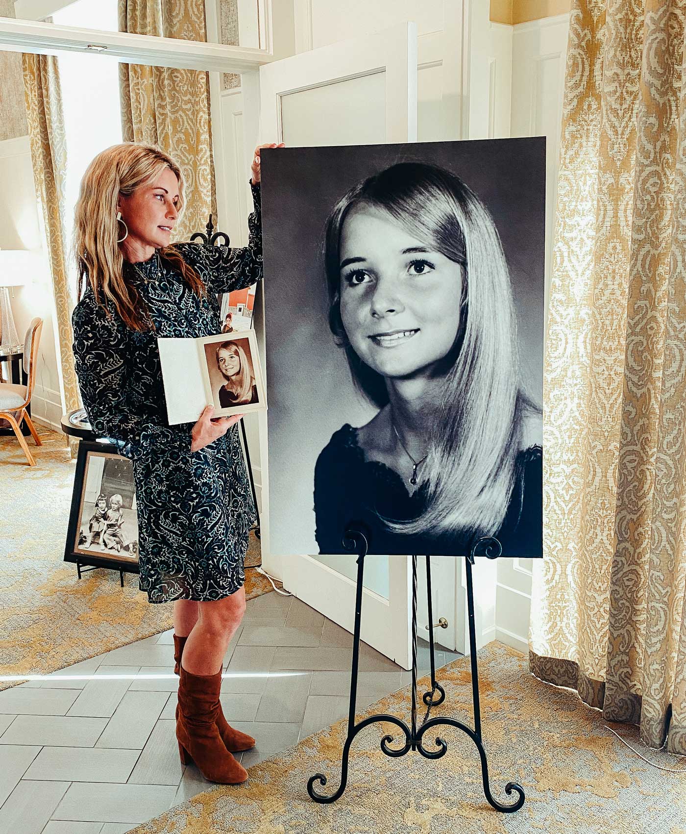 Chari Pack with a large printed portrait of her mom