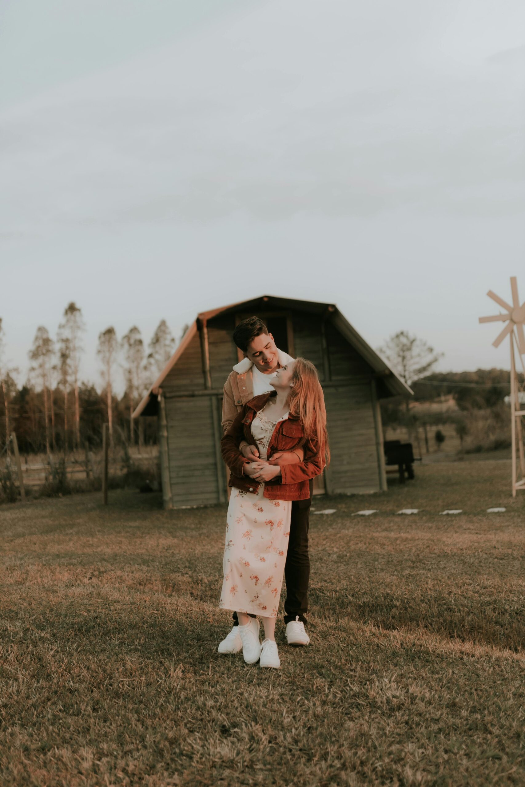 Parents holding a toddler in cozy fall layers