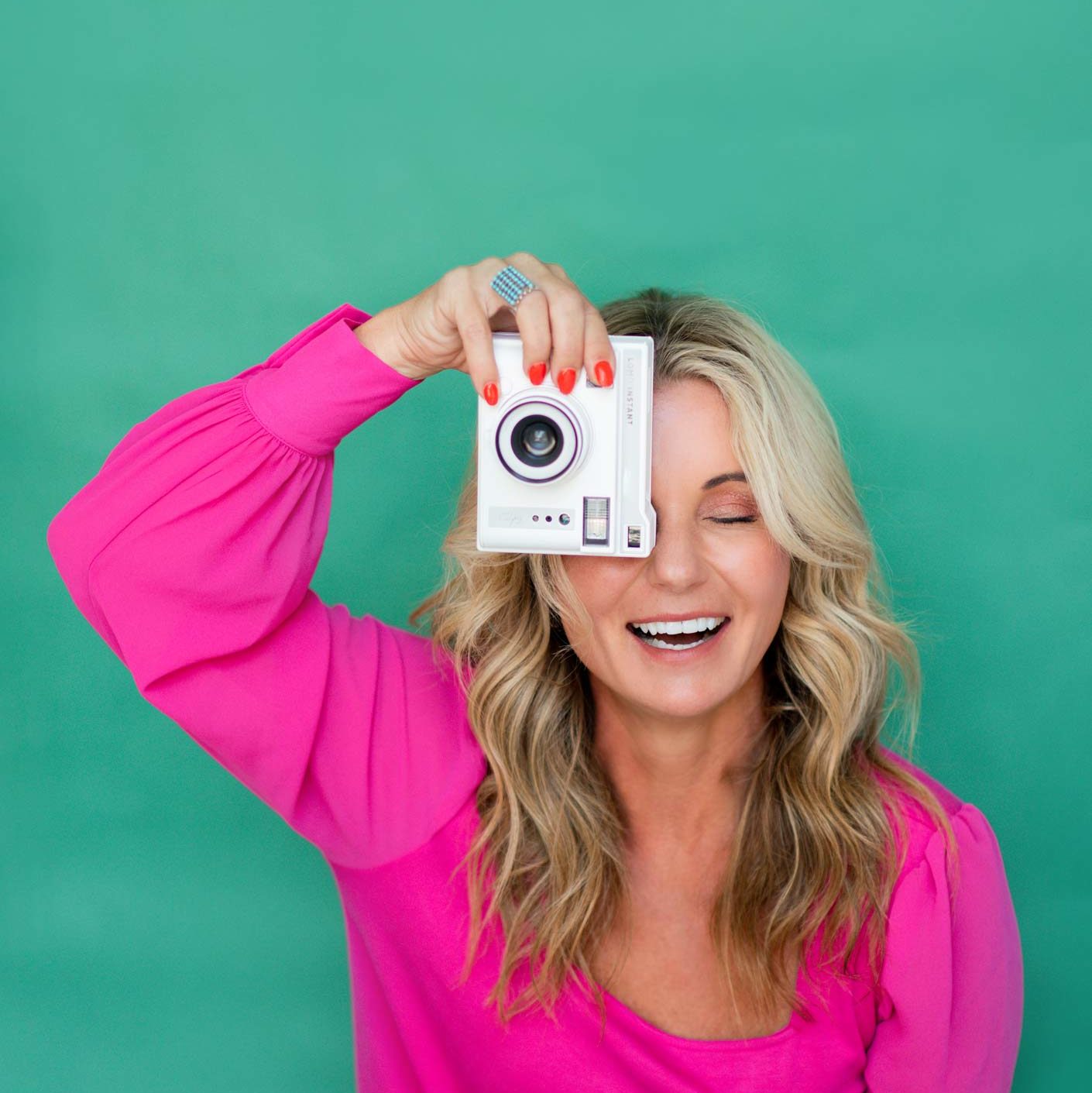 Chari Pack today, holding a camera