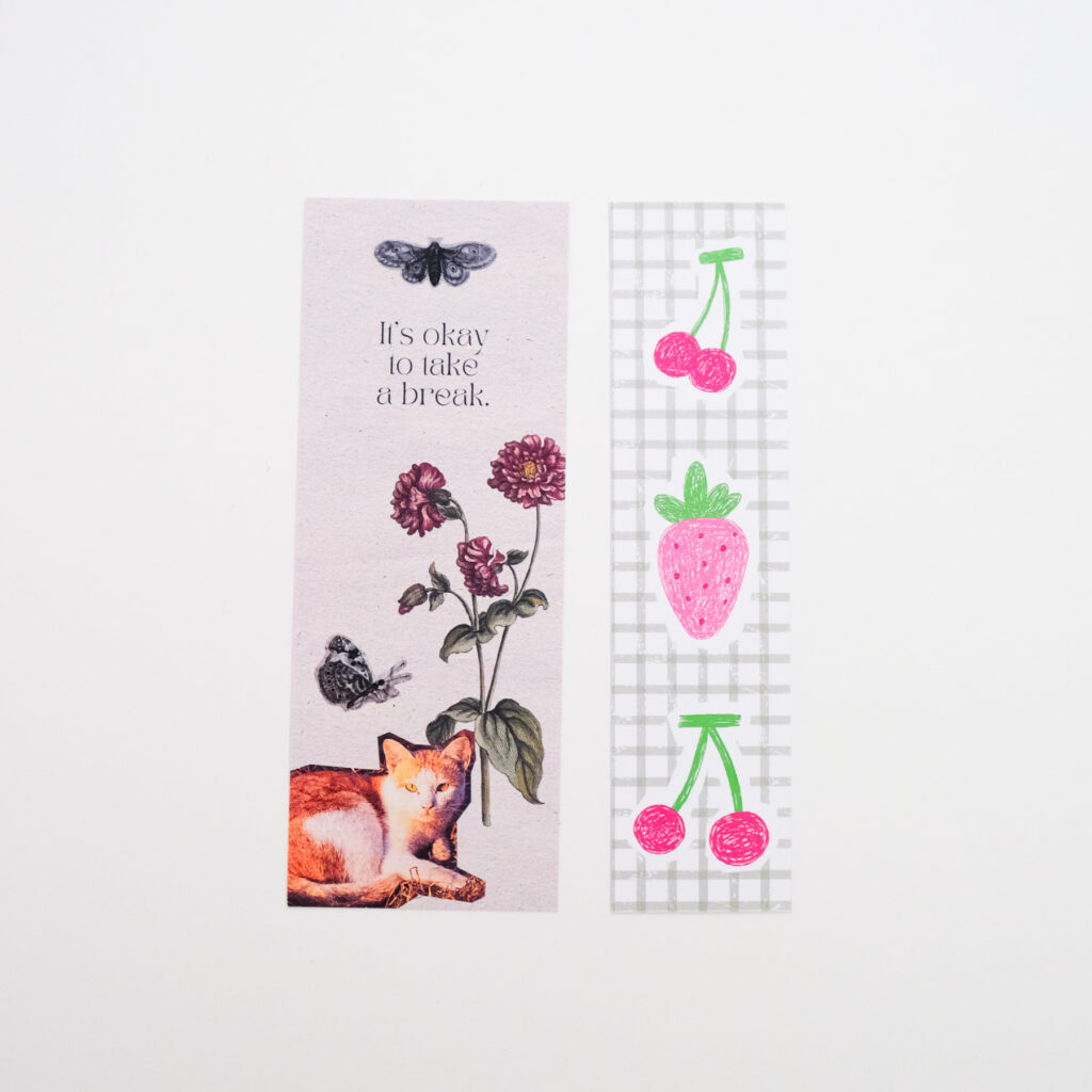 Floral quote bookmark next to a strawberry and cherry bookmark