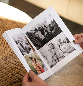 Open photo album filled with black and white family photos