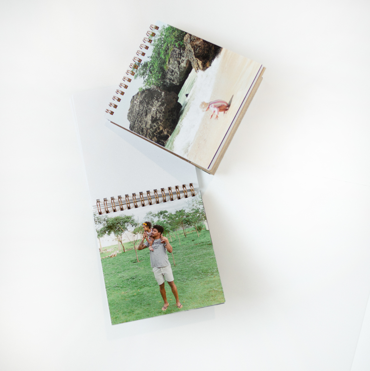 Two flip photo books standing on a desk