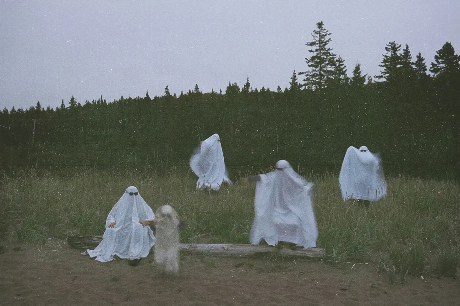 Ghostly motion blur Halloween photo of a figure in a sheet costume